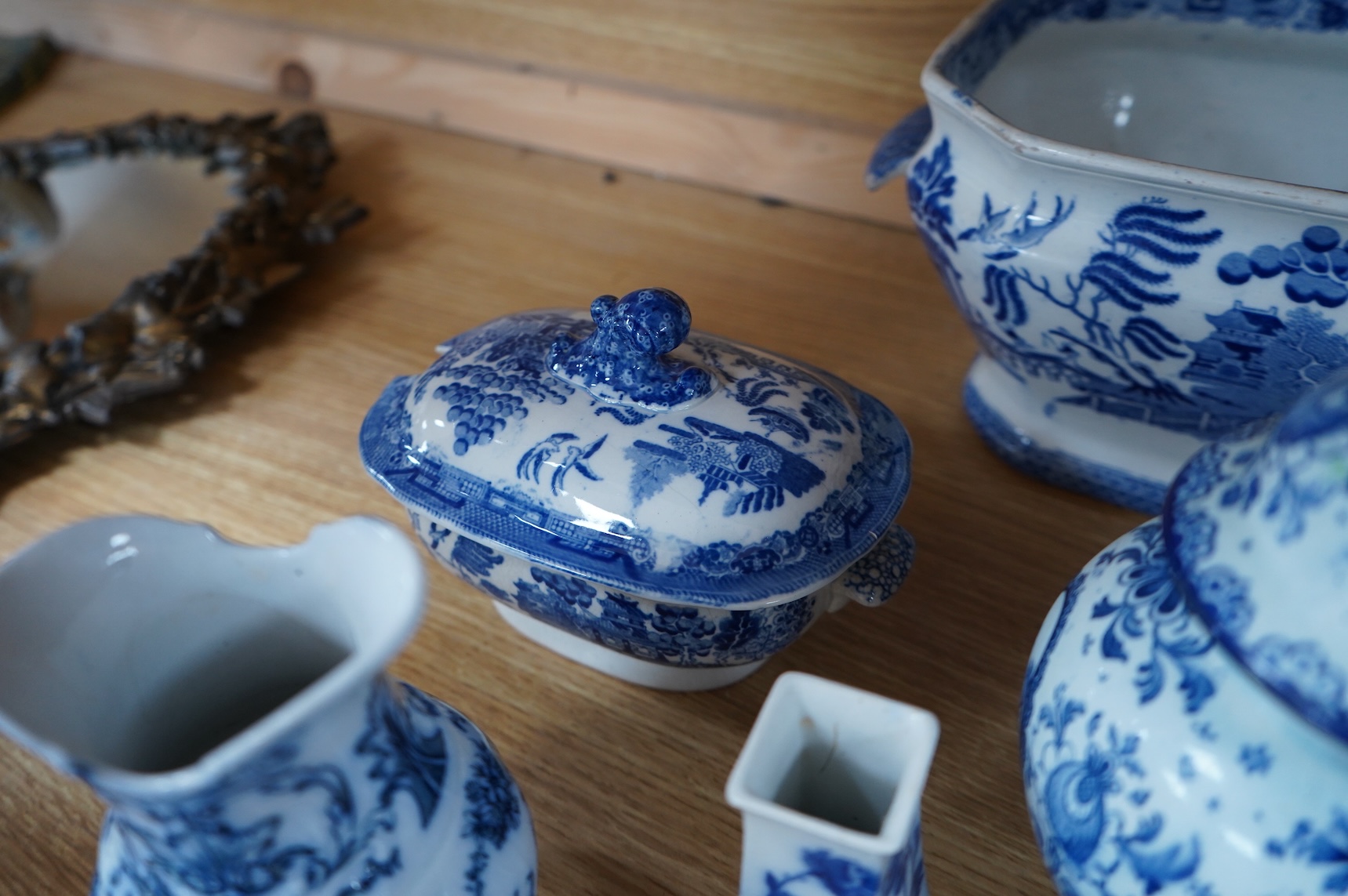 A group of blue and white Willow pattern china, 19th century and later and a Meissen cup and. Saucer. (12).